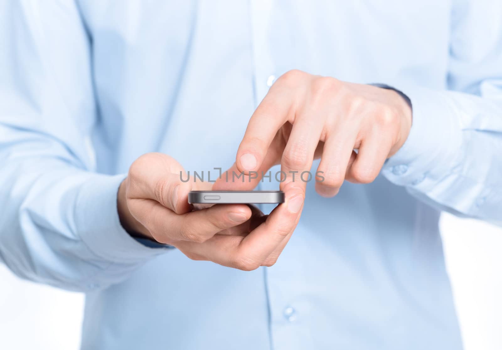 Businessman holding and touching screen on mobile phone. Close-up photo.