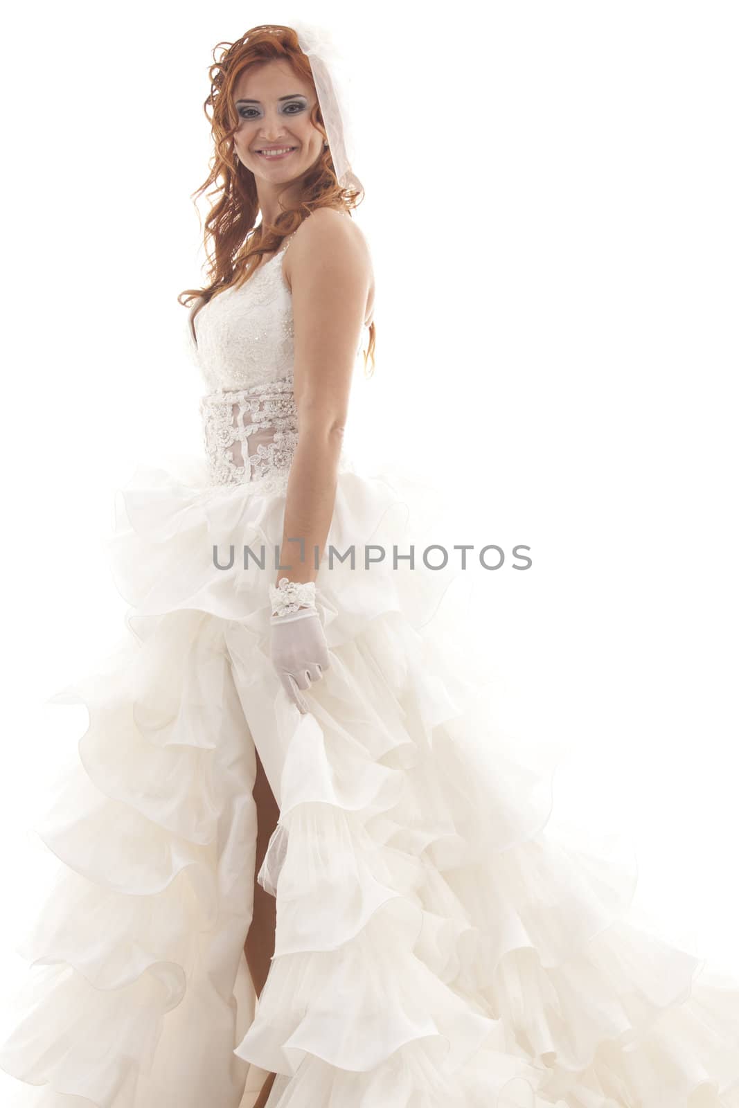 Portrait of young beautiful smiling bride over white background