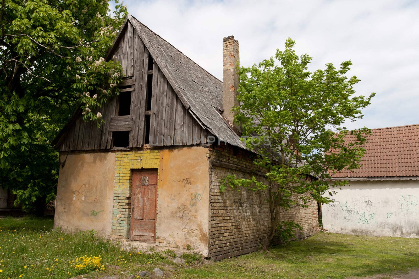 A abandoned house with breaked roof side