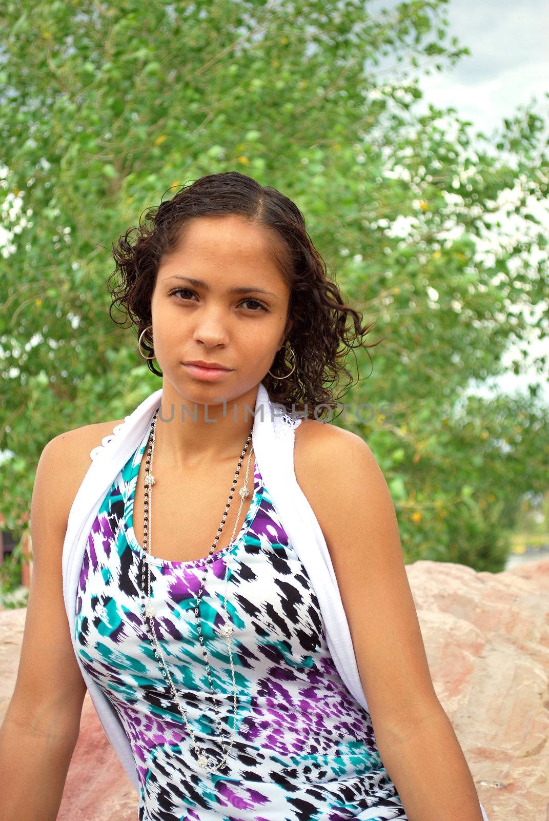 African american female fashion model posing outdoors.