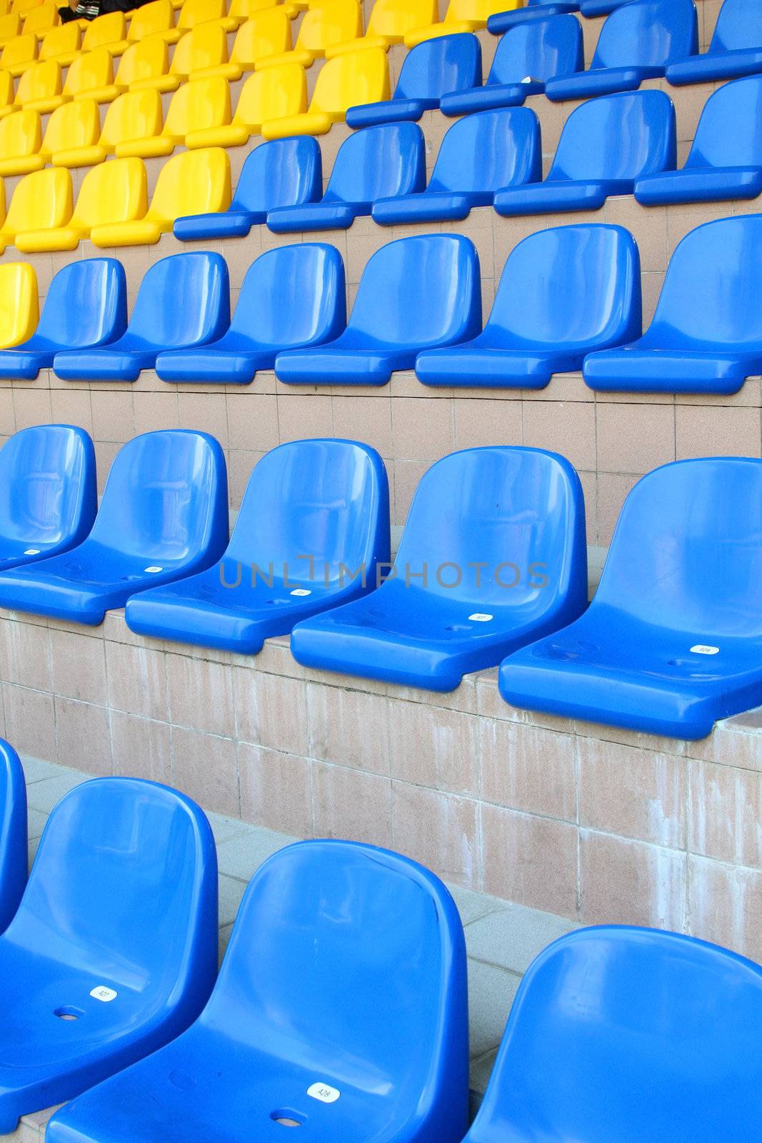 Stadium seats in blue and yellow color