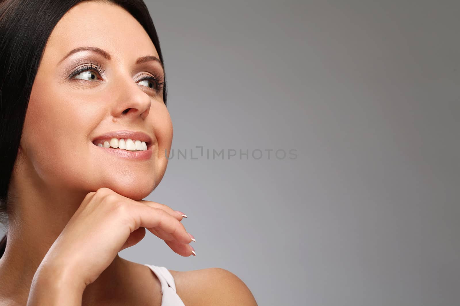 Beautiful woman with natural makeup isolated over background