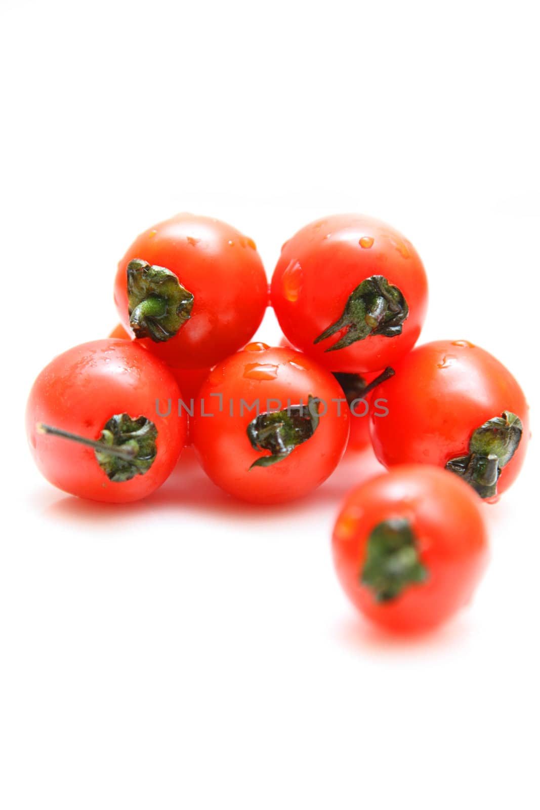 Cherry tomatoes isolated on white background