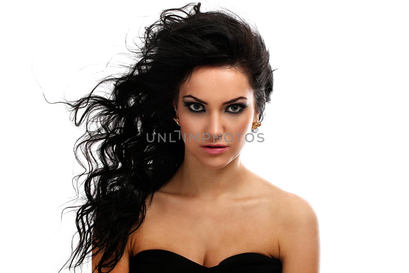 Beautiful brunette with curls evening makeup isolated over white background