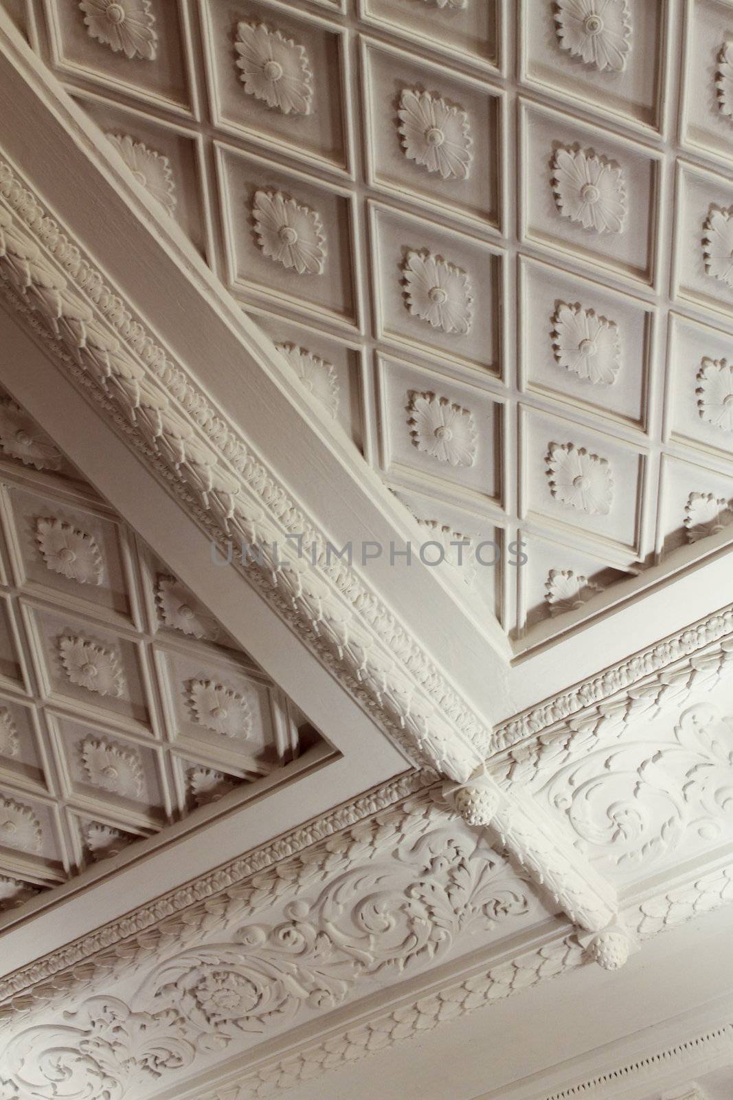 Diamond plaster and bunch moldings on the ceiling texture