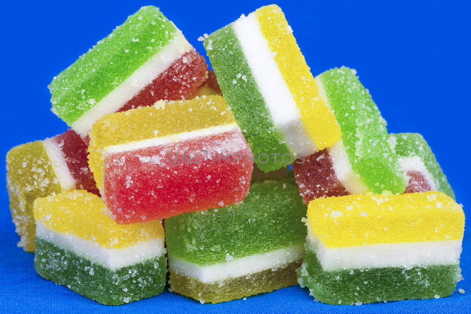 Sweet jelly candies in different colors with sugar
