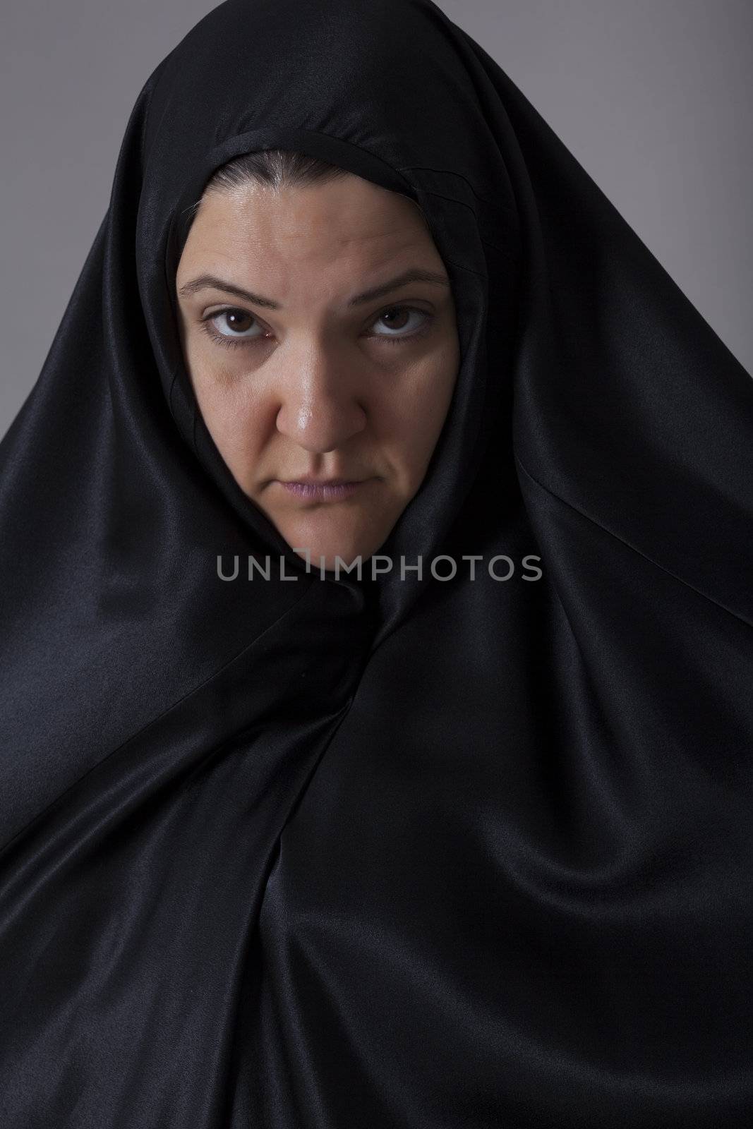 Muslim middle east woman covered with black veil