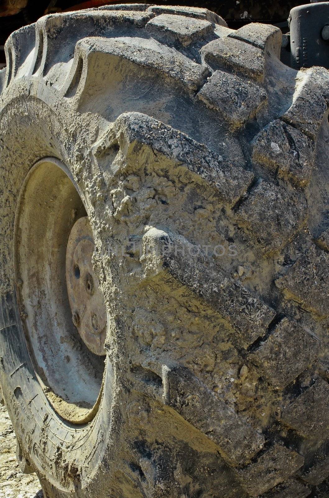 Big heavy tire and wheel on construction area