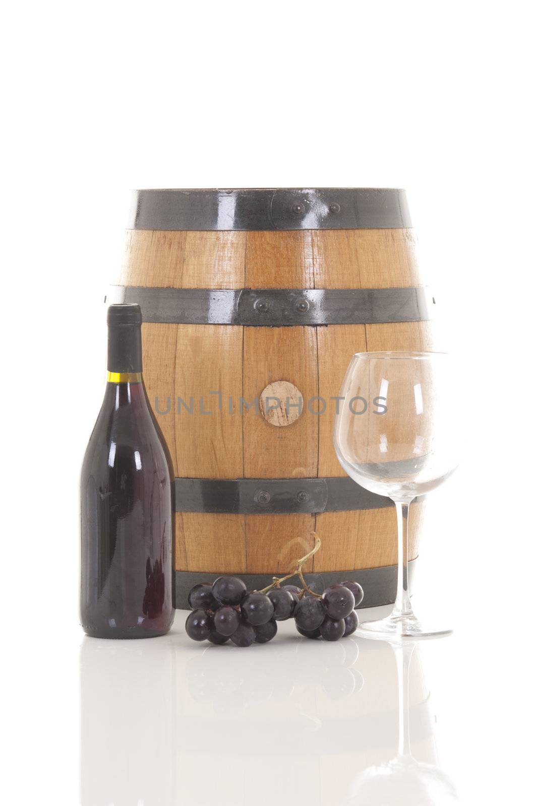 Red wine with grapes and barrel by senkaya