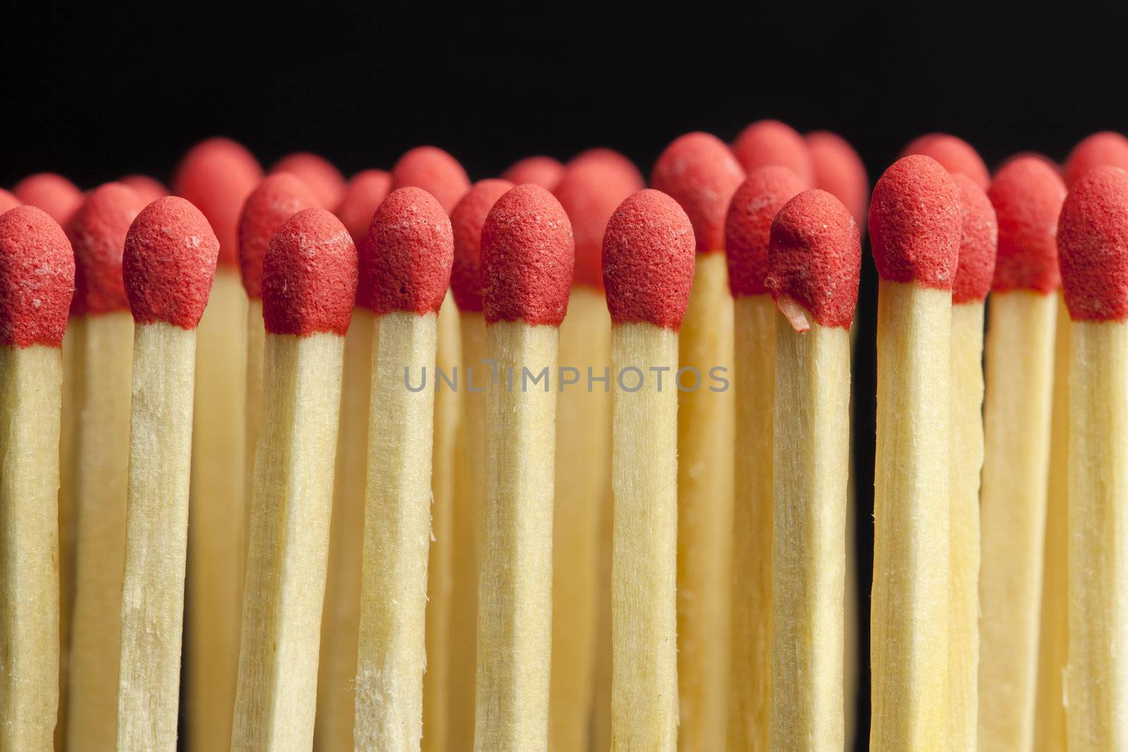 Matches in rows on a black background