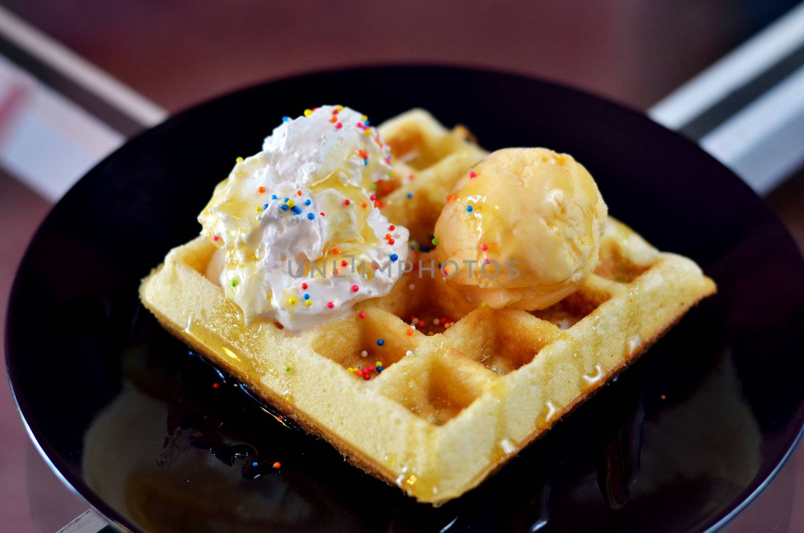 Waffle and whipping cream with vanilla ice cream