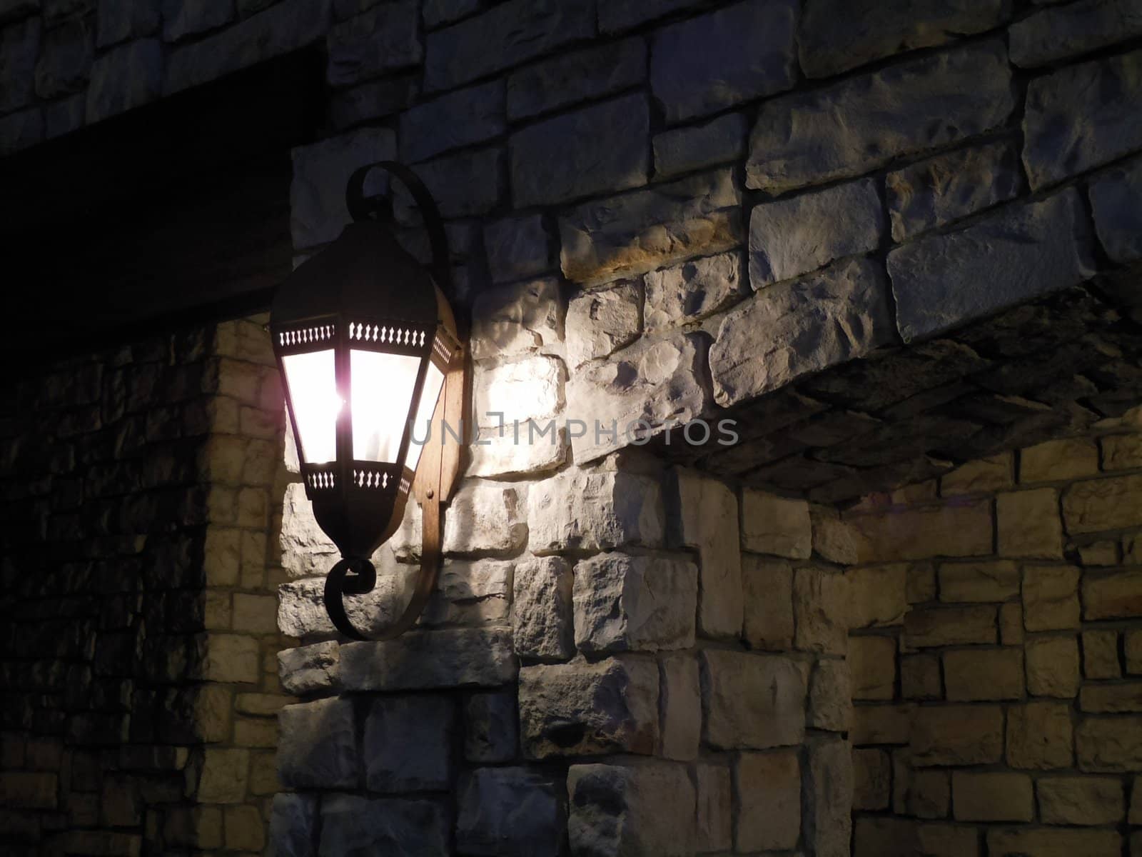 Lamp on a Rock Wall by RachelD32