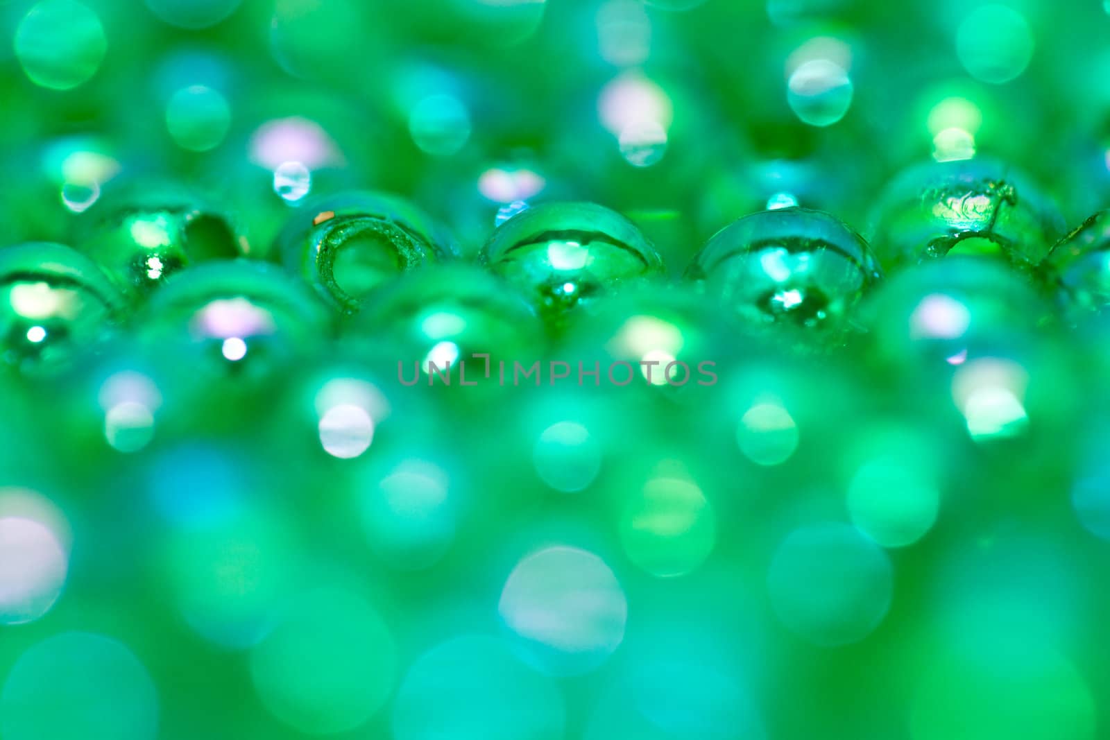 Green beads on the mirror with shallow DOF in landscape  orientation