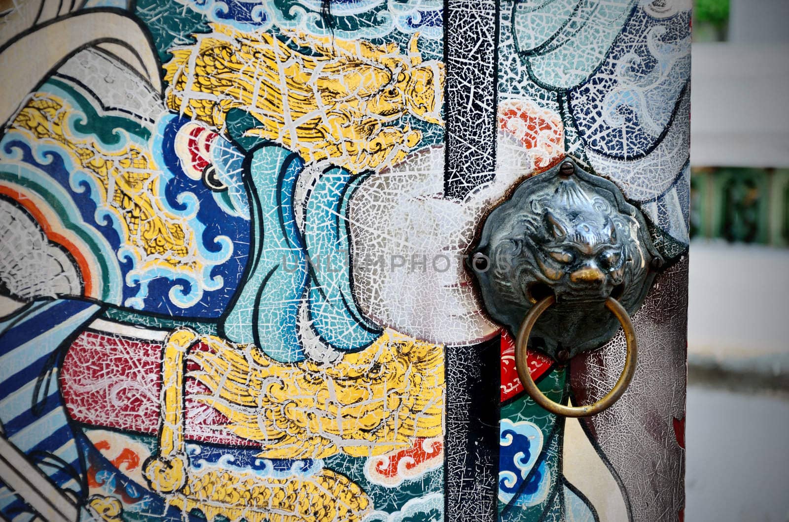 Ancient lion door handle with nice old Chinese art painted, Bangkok, Thailand