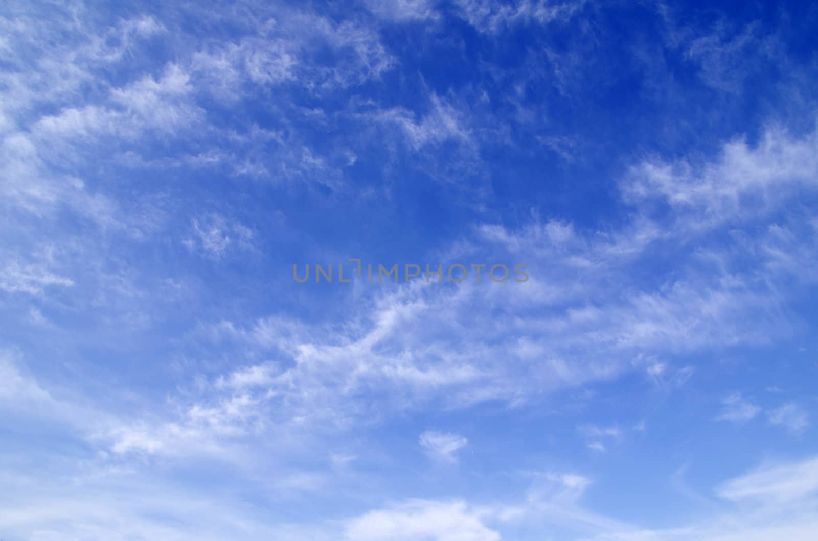 blue sky background with tiny clouds