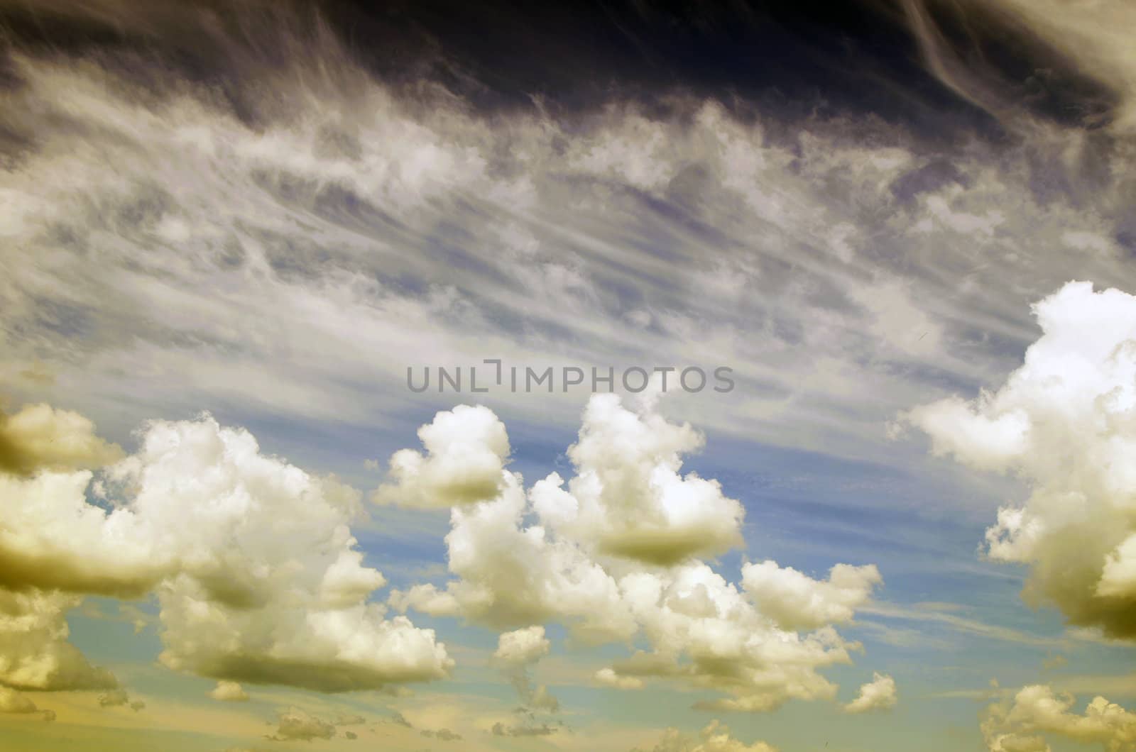 Blue sky background with tiny clouds