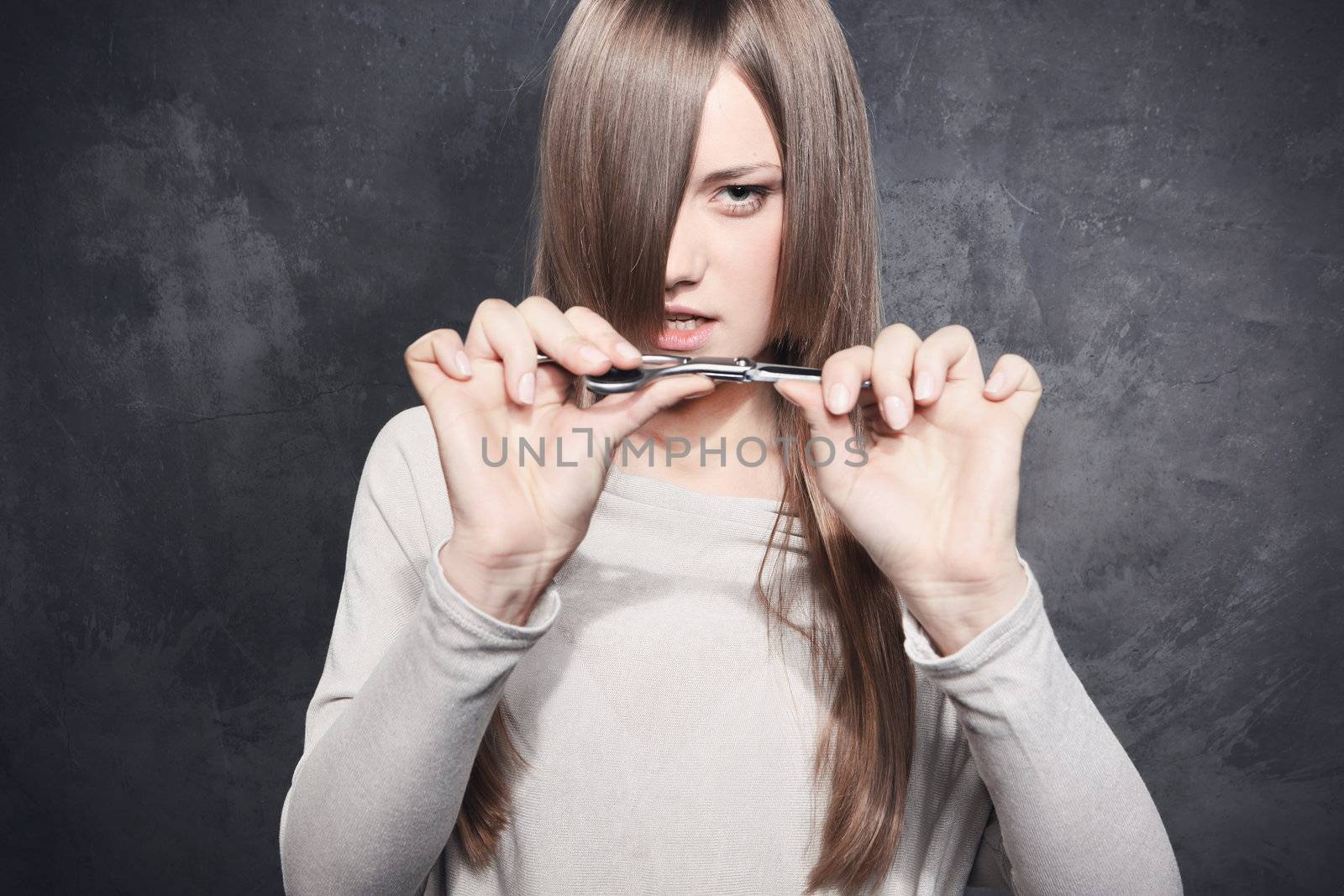 Girl holding a pair of scissors