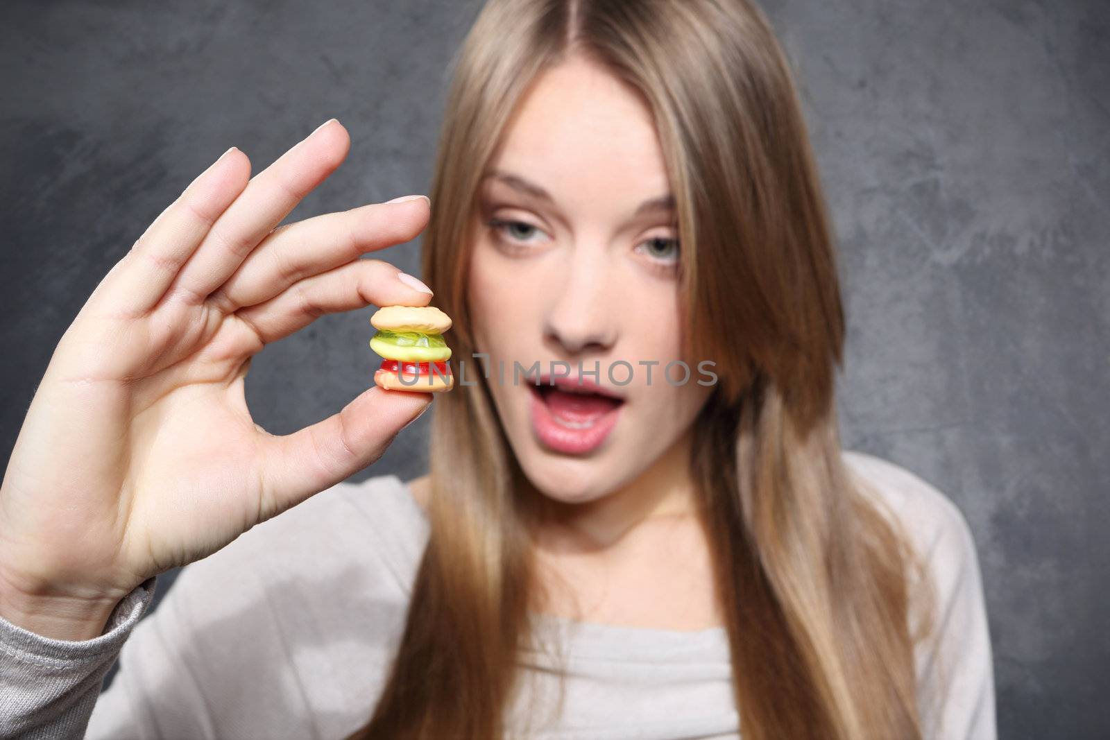 Girl holding a biscuit