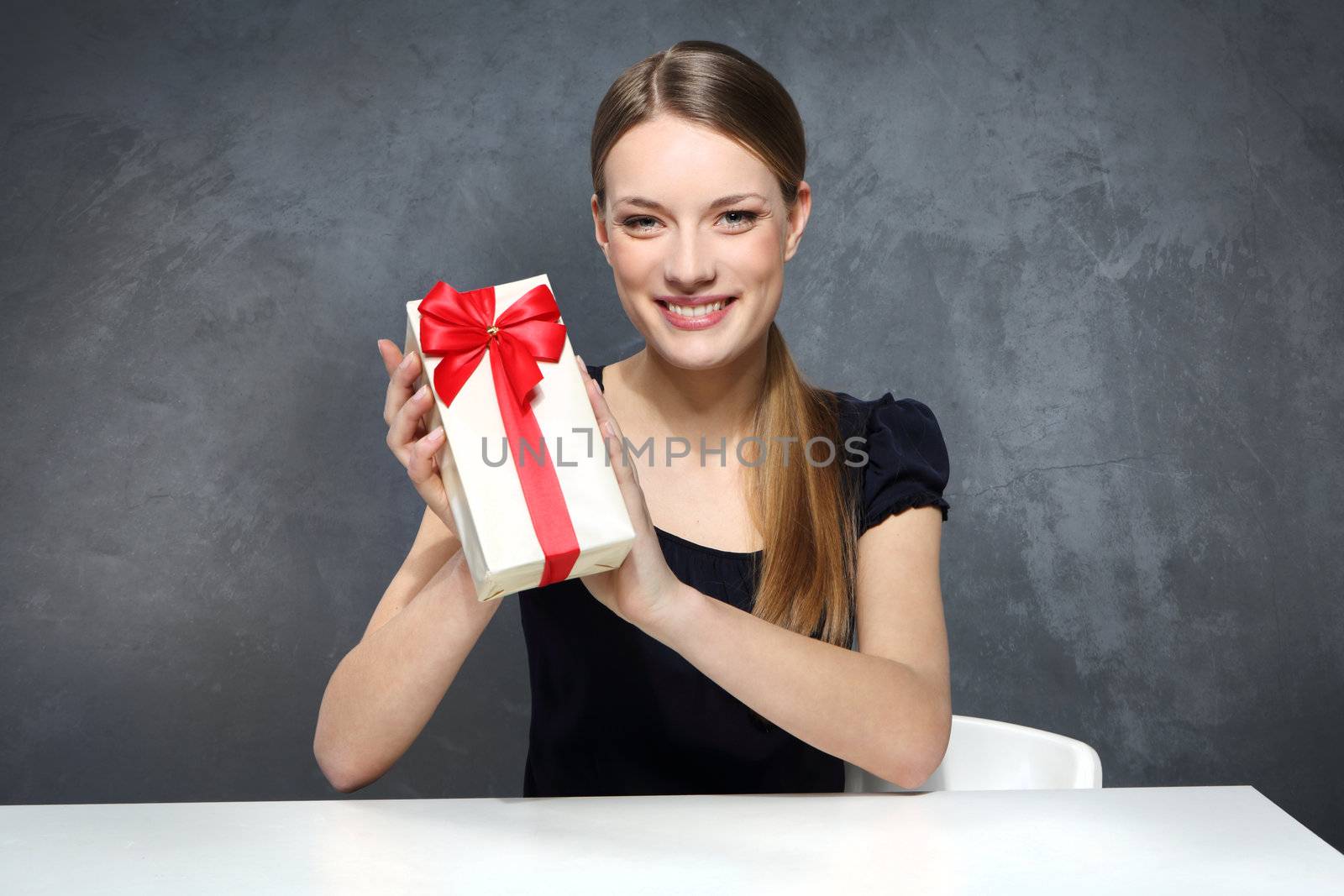 Girl holding a box with a gift