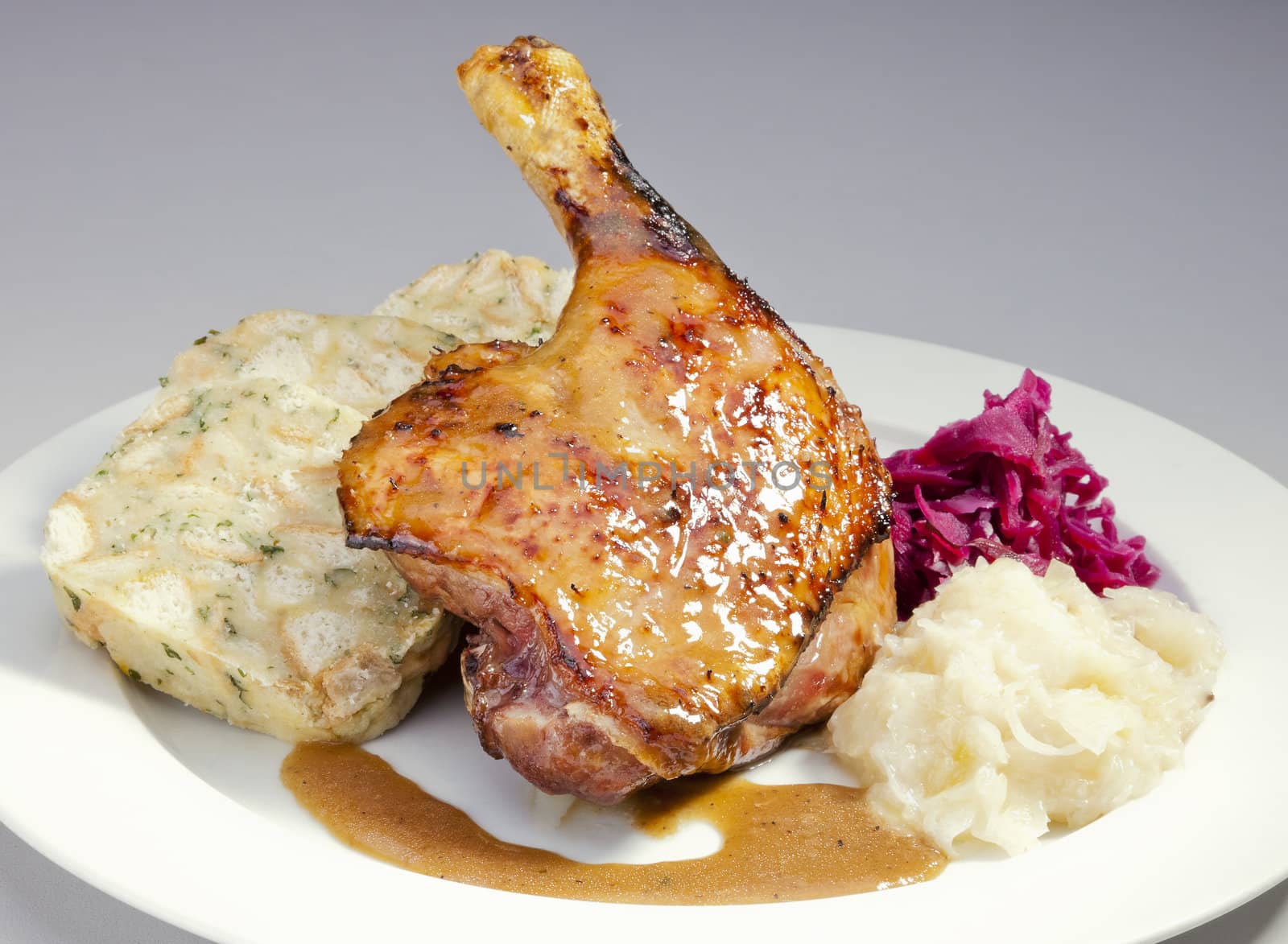 Baked duck with red and white cabbage and dumplings