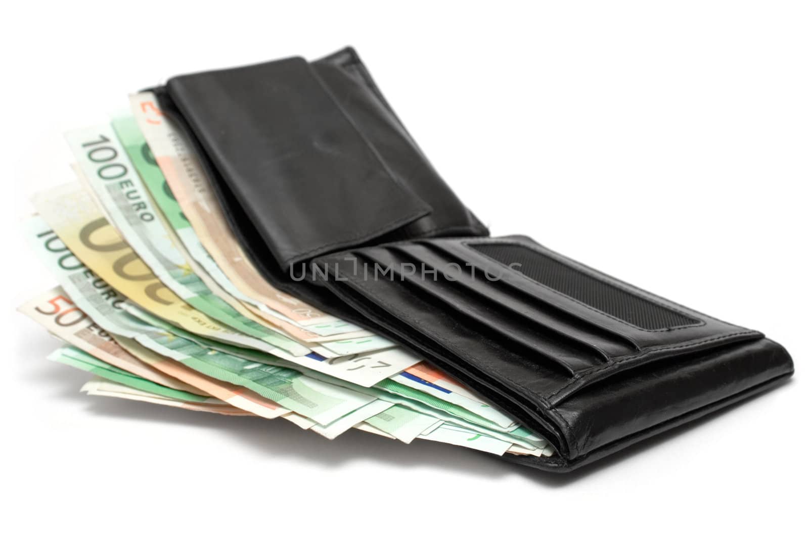 Open leather wallet with banknotes isolated on a white background.