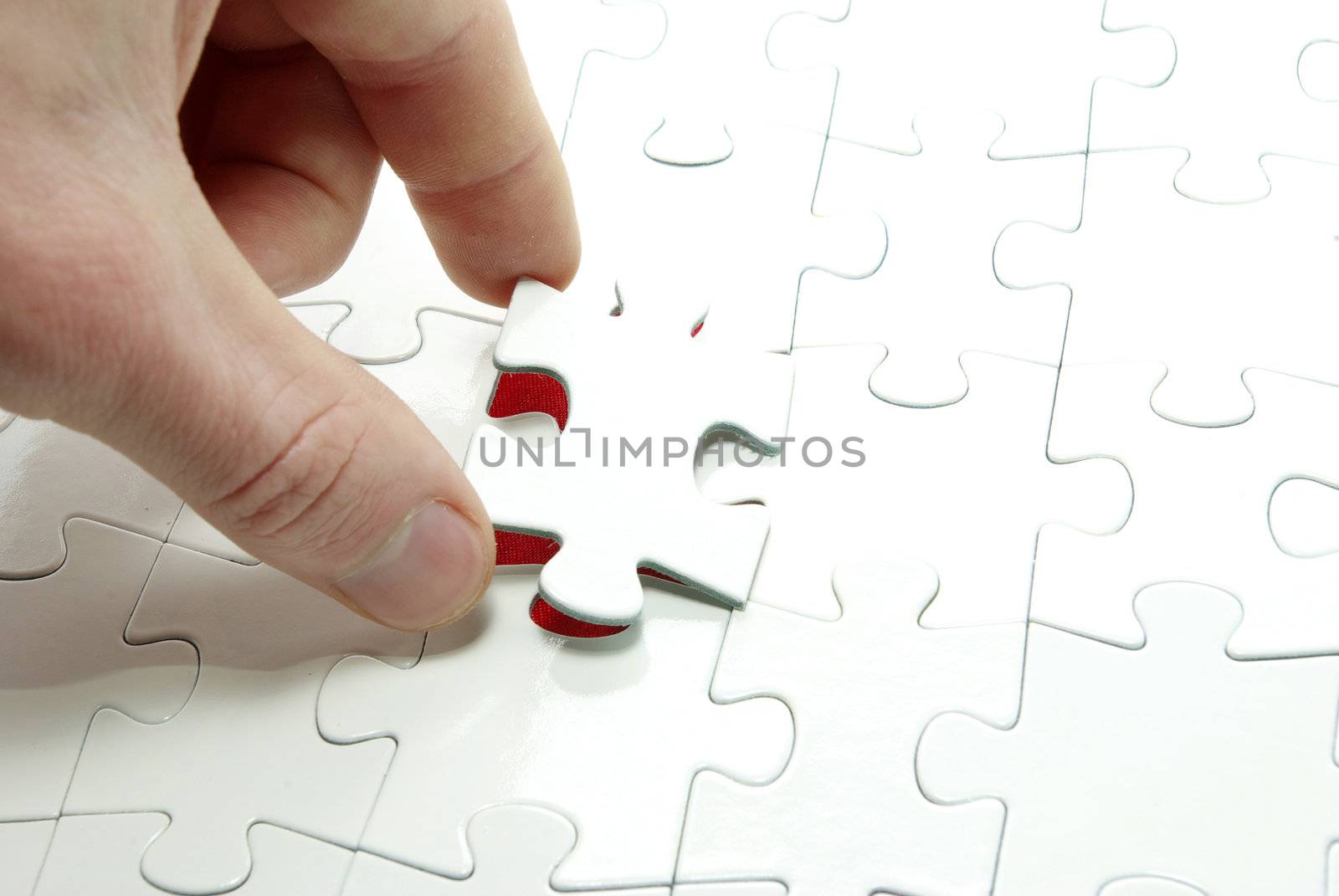 hands holding a puzzle piece . business concepts