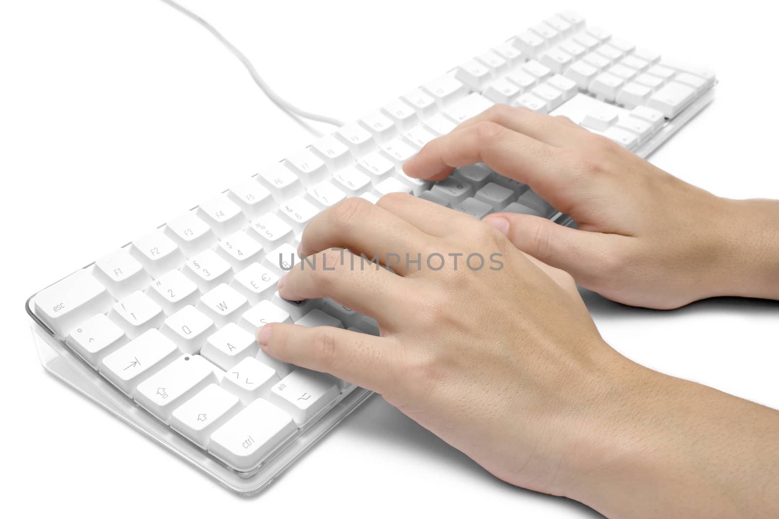 Female hands writing on a white computer keyboard. Isolated on a white background.