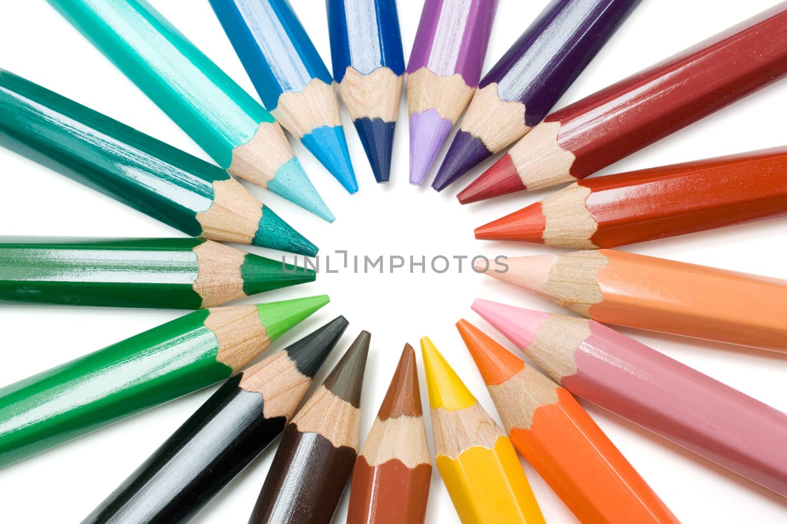 Colored pencils forming a circle. Isolated on a white background.