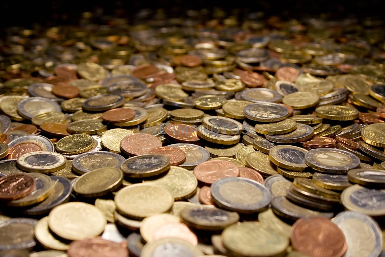 Coins all over the place. Shallow depth of field.