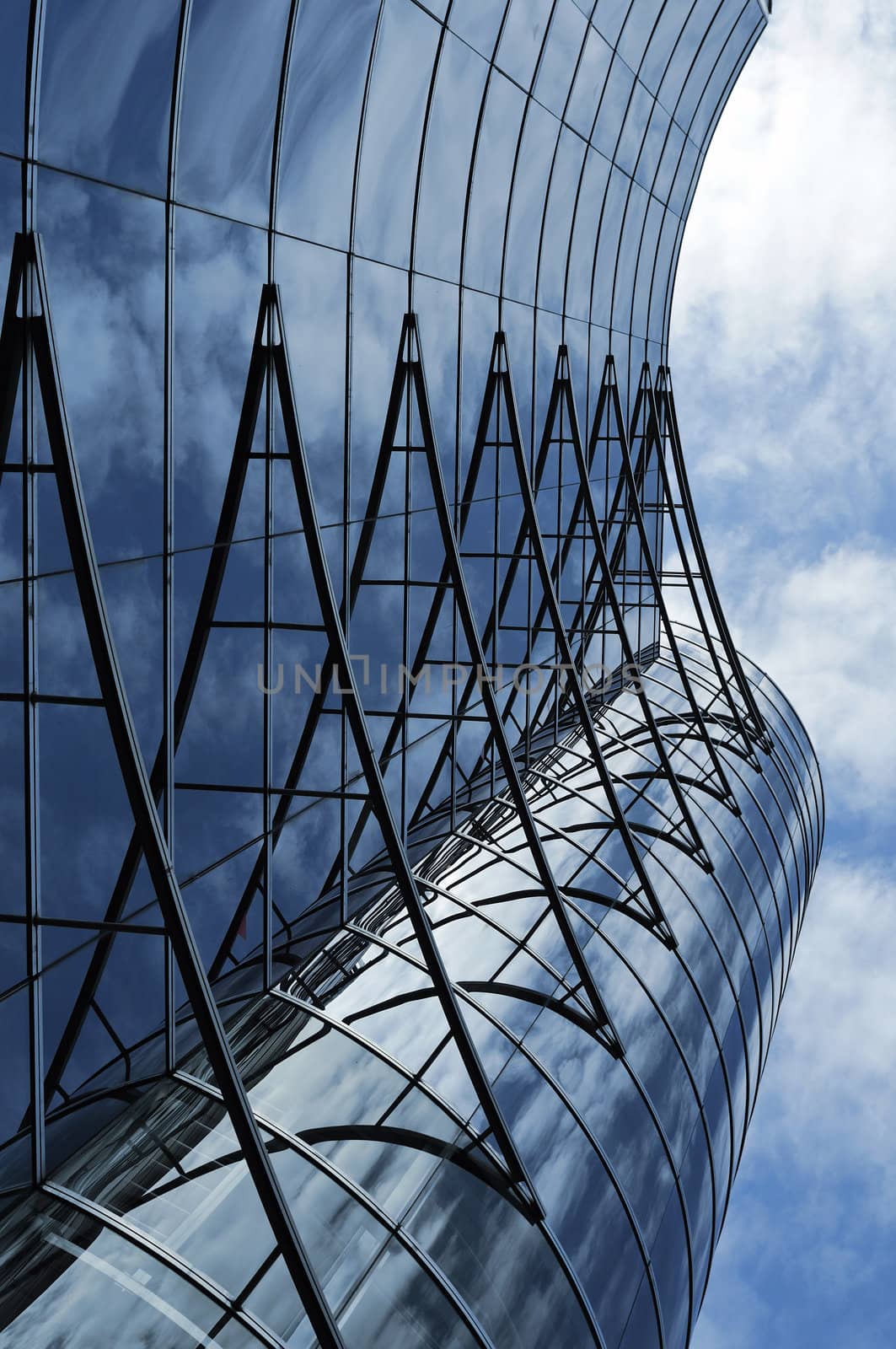 modern building glass wall with bright sky reflection in Tokyo metropolis, Japan