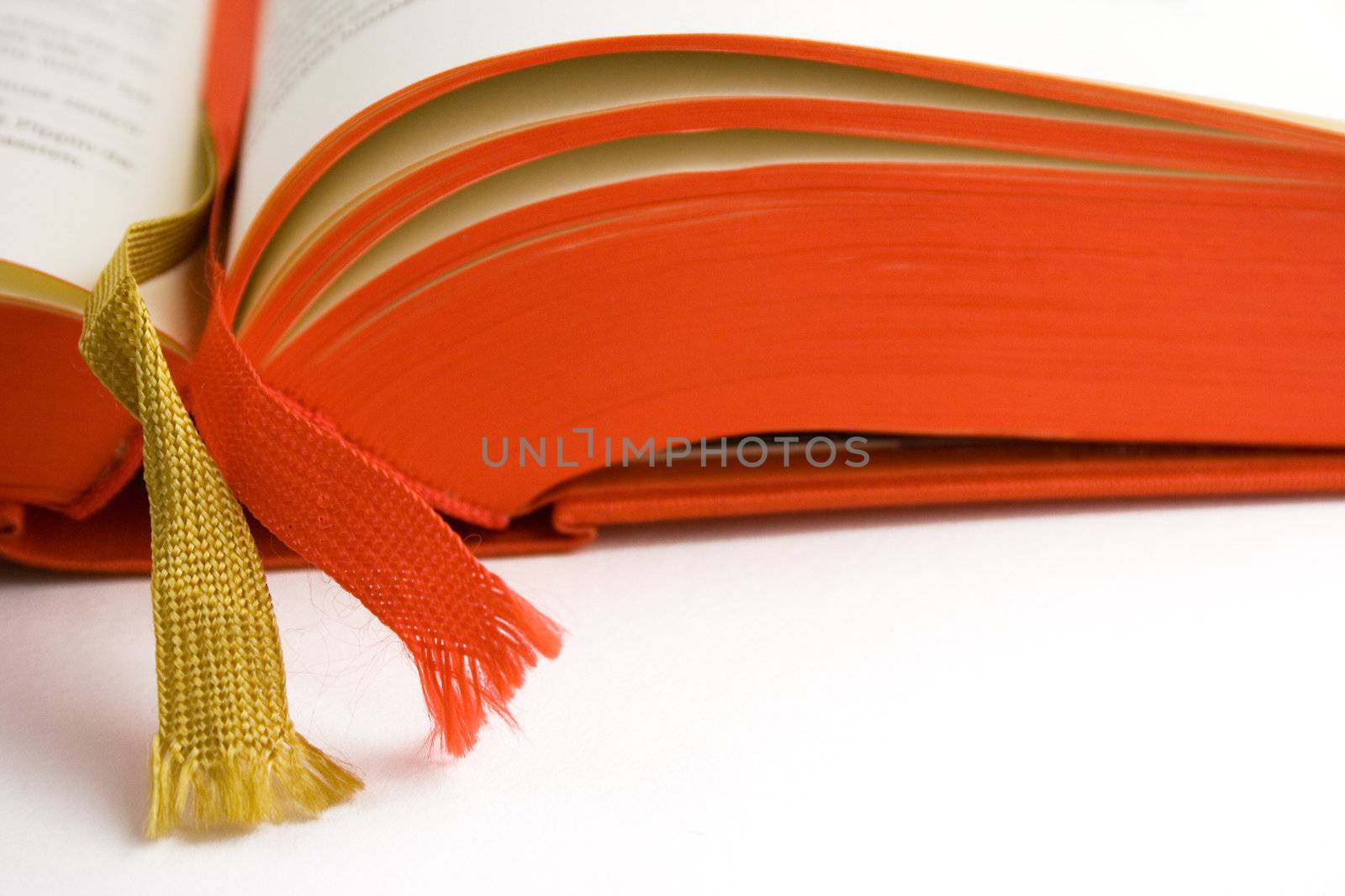 Open red book. White background.