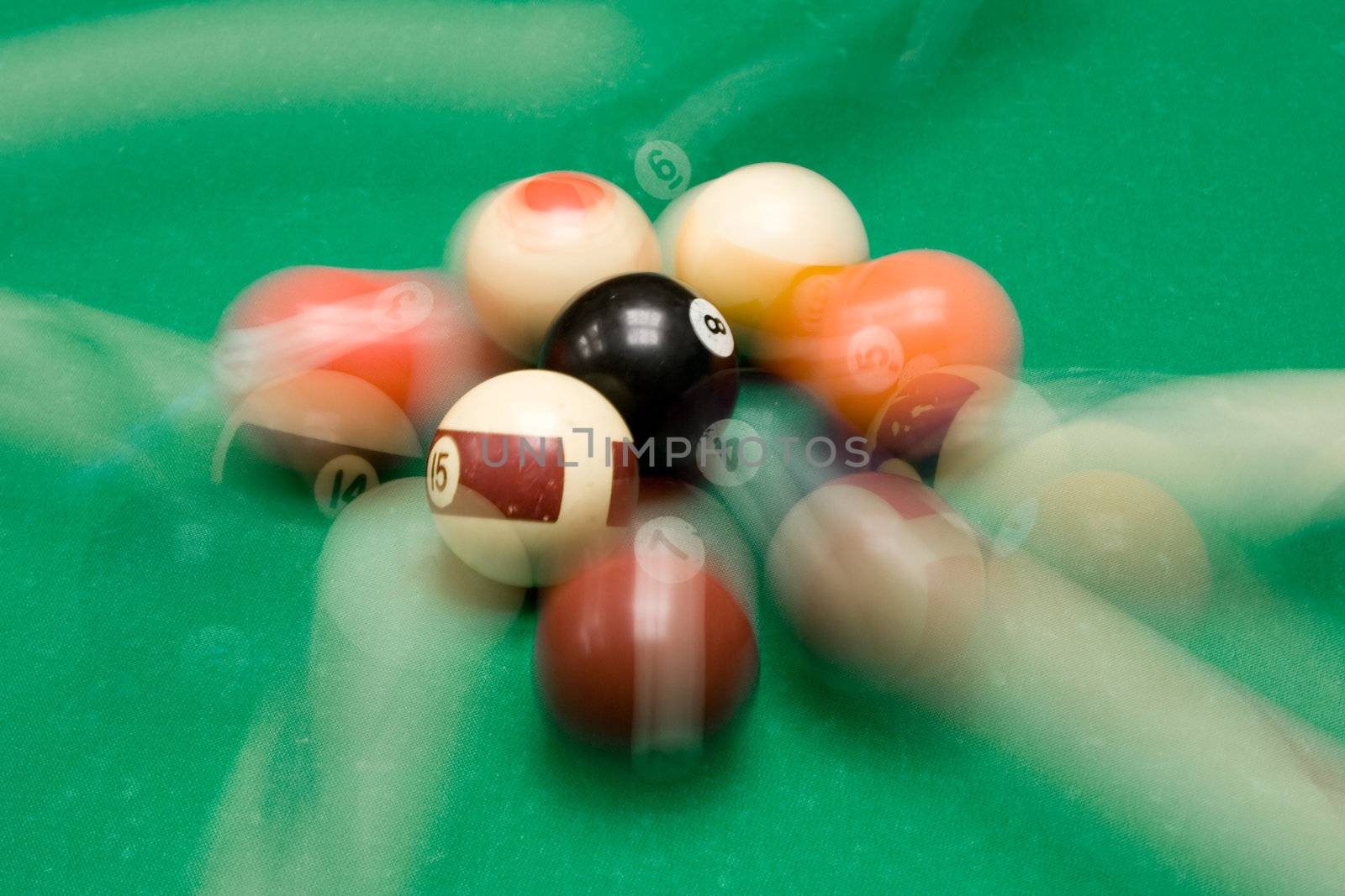 Colorful billiard balls in motion.