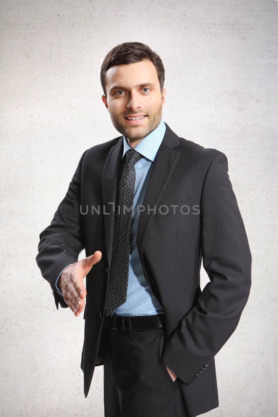 A business man with an open hand ready to seal a deal