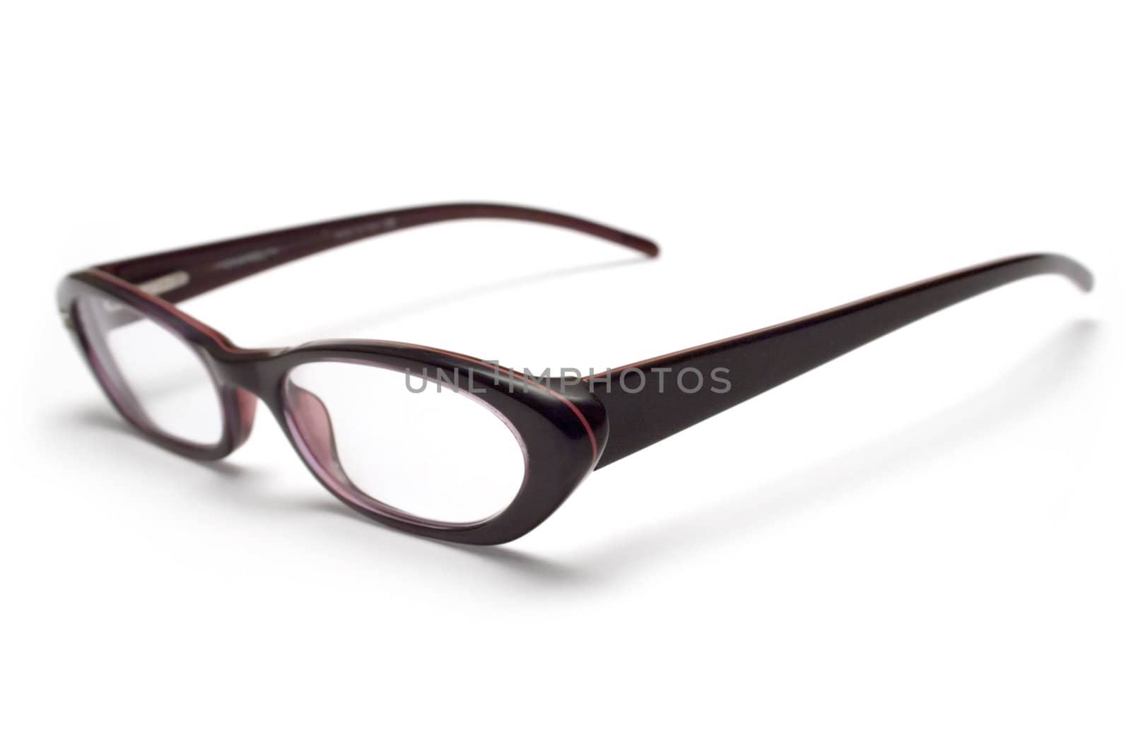 Feminine eyeglasses isolated on white. Shallow depth of field.