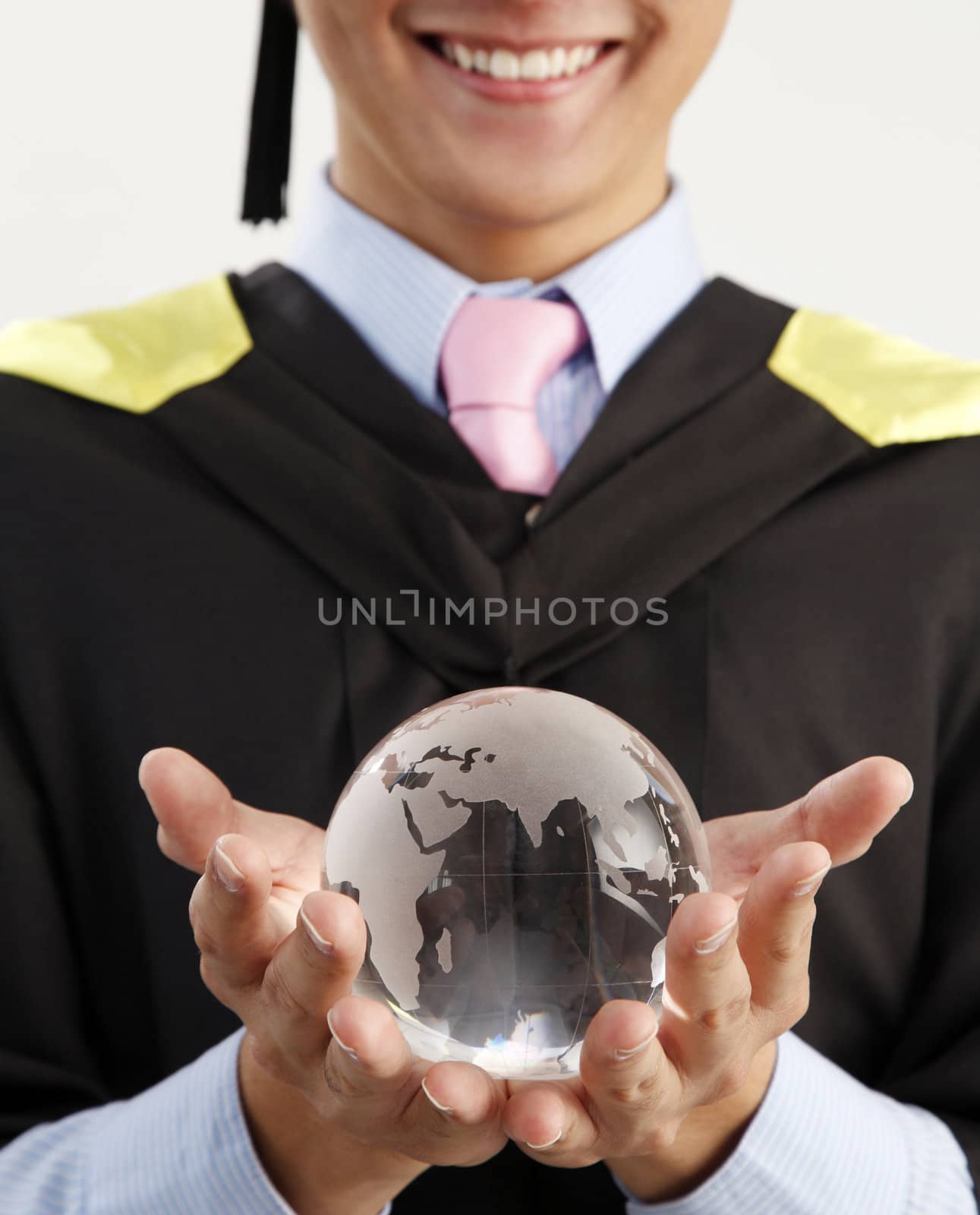 mid section of the man holding glass globe
