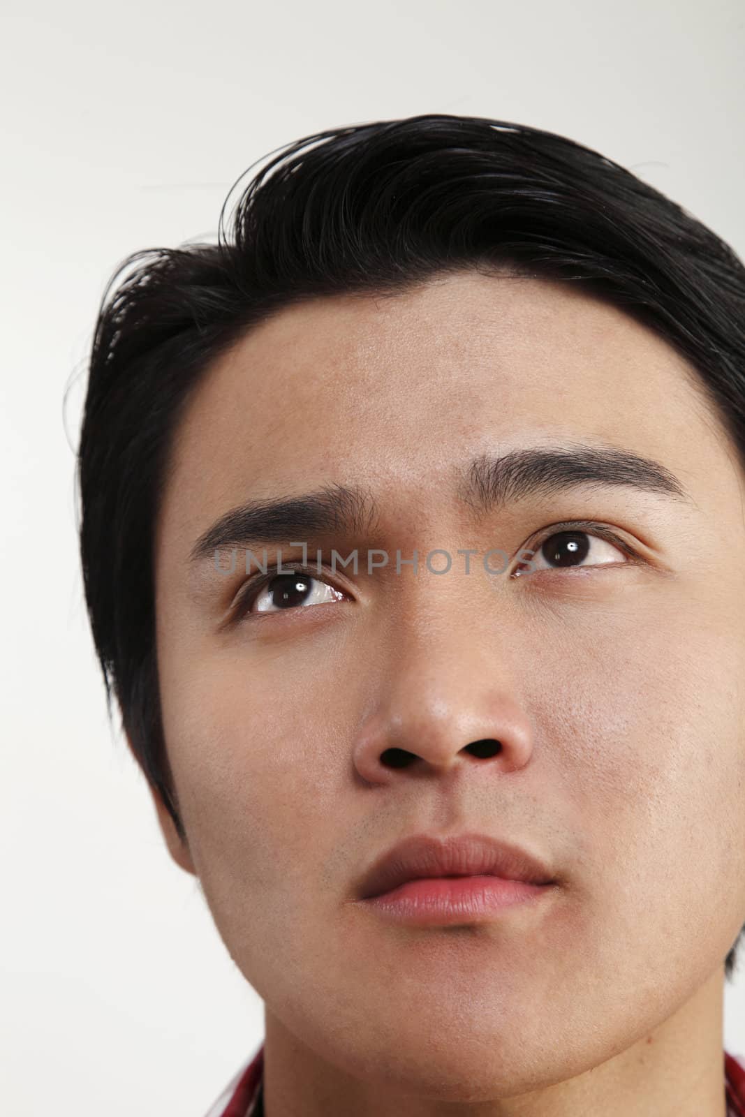 Man looking up with worried expression