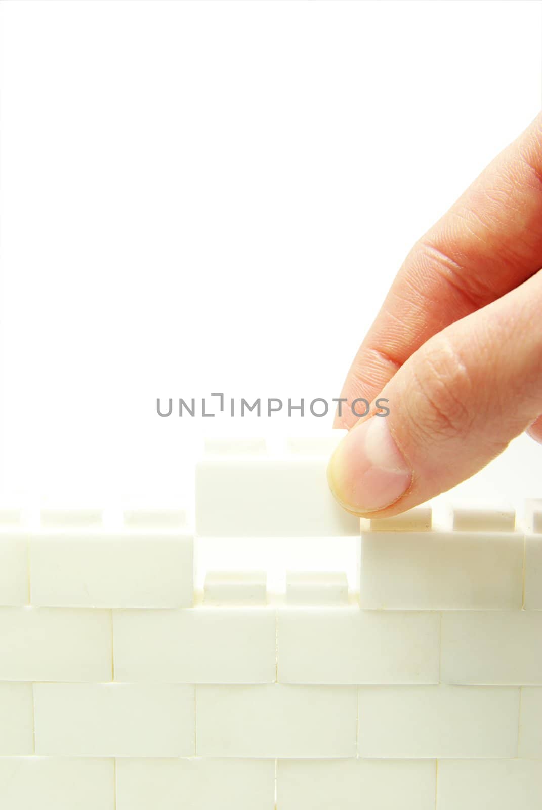 compleeting the wall on a white background