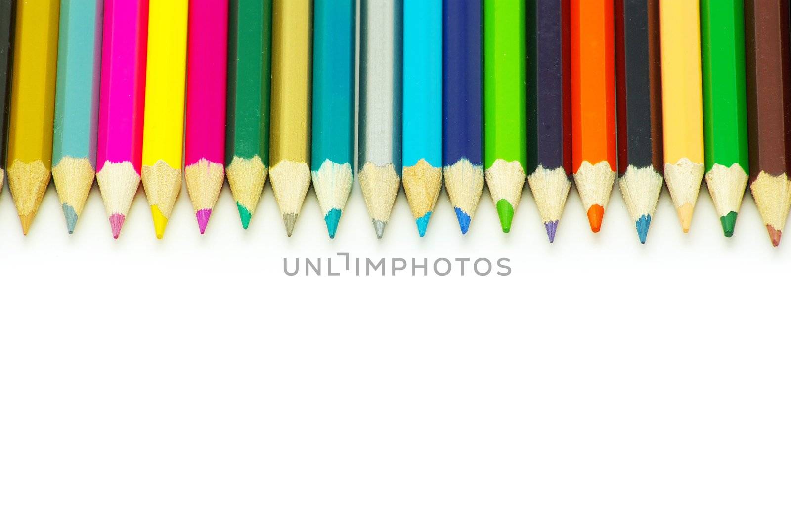  Assortment of coloured pencils  on white background