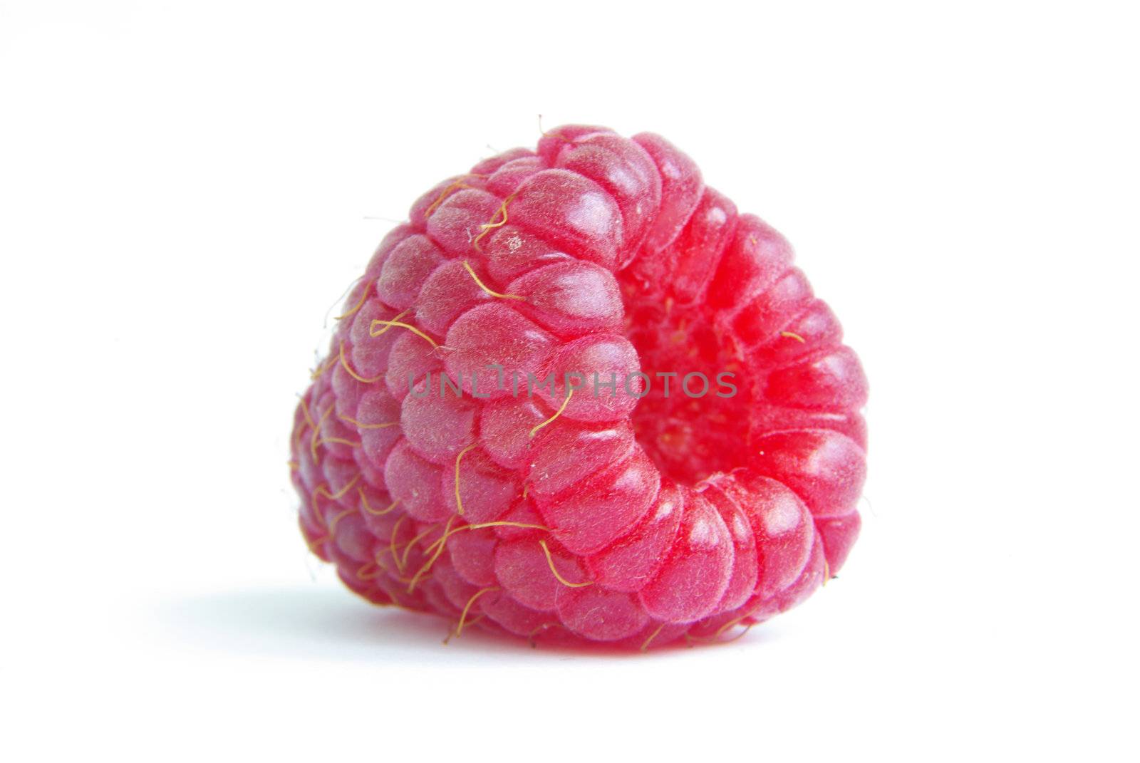 Ripe raspberry on a white background