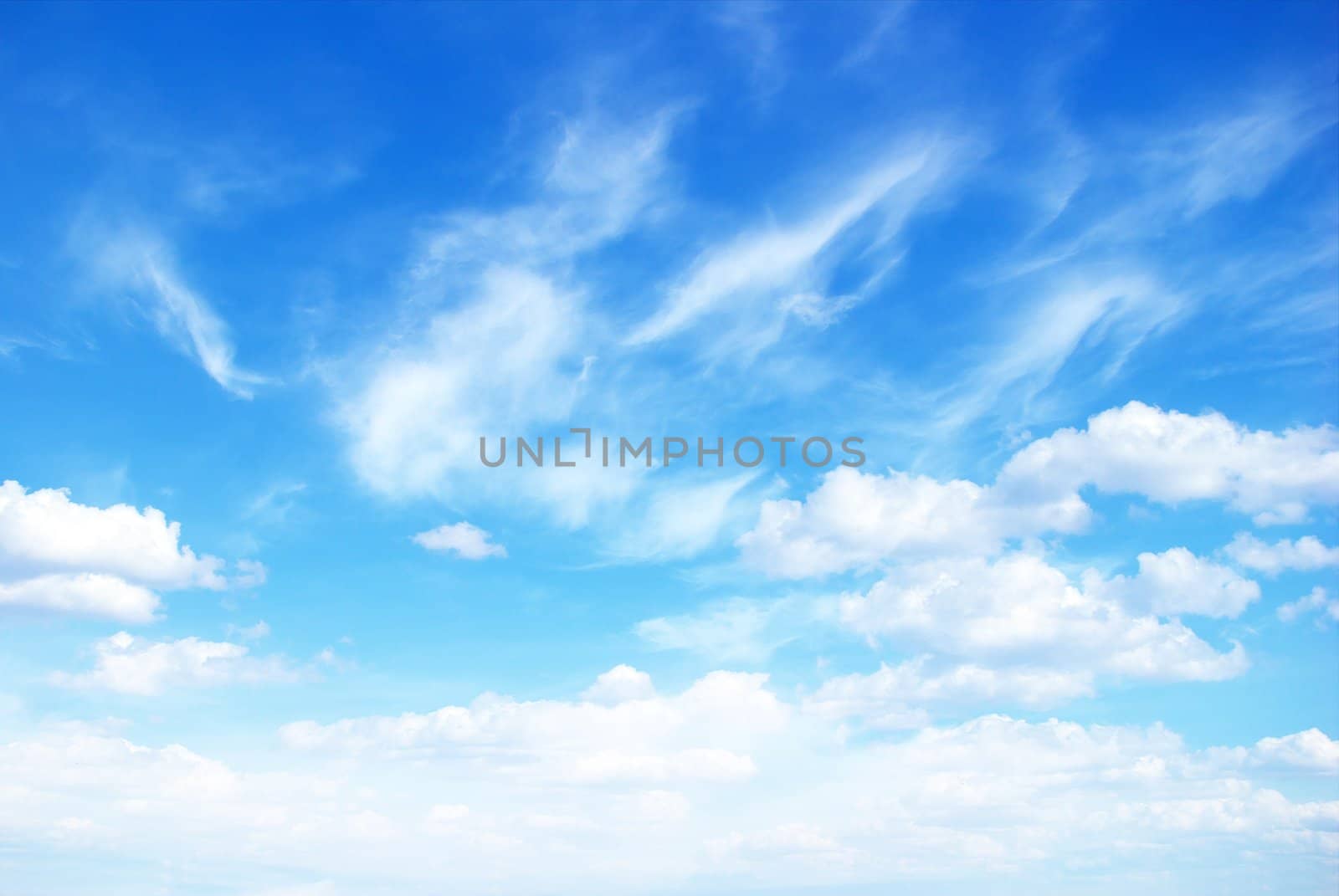 blue sky background with tiny clouds