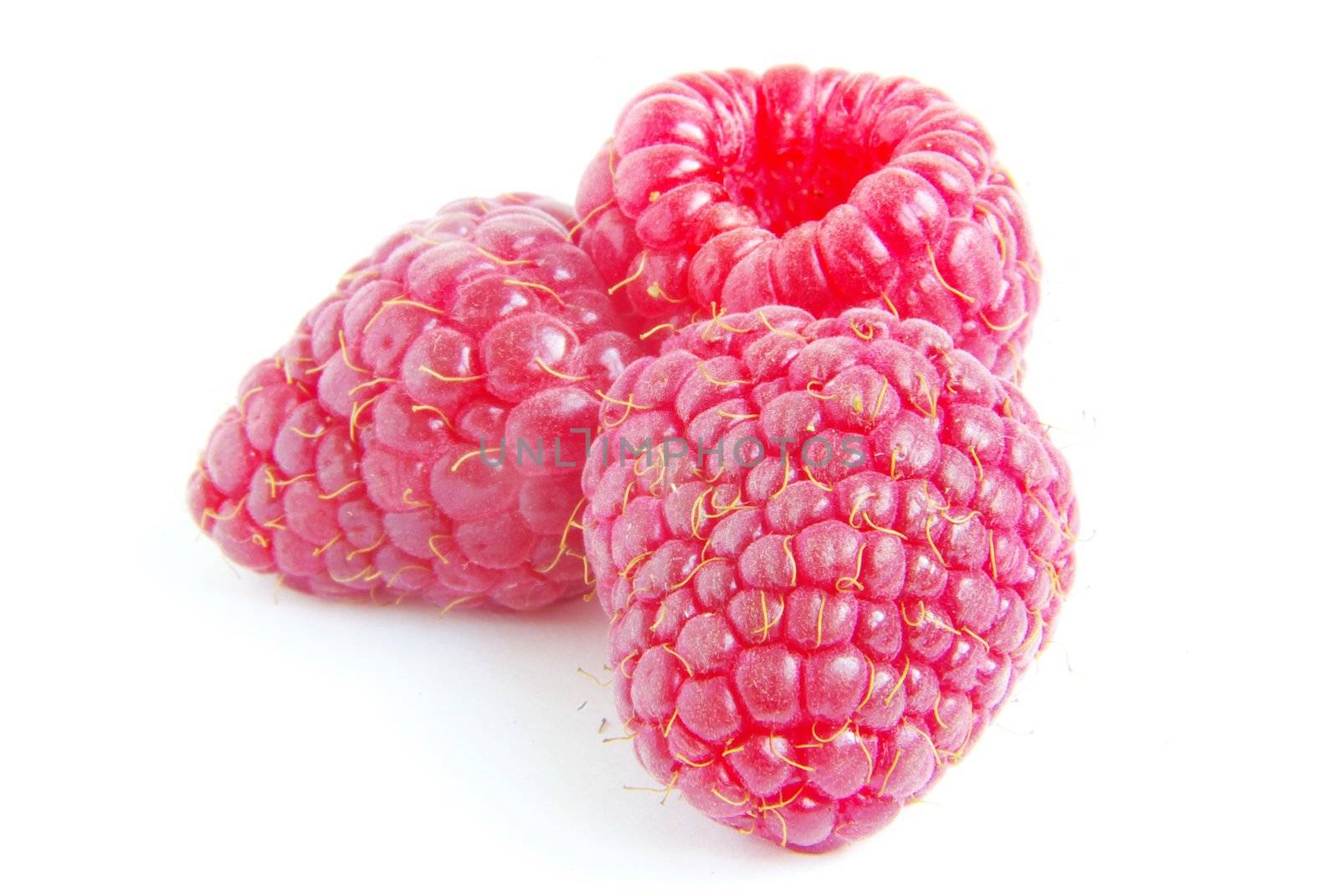 Ripe raspberry on a white background