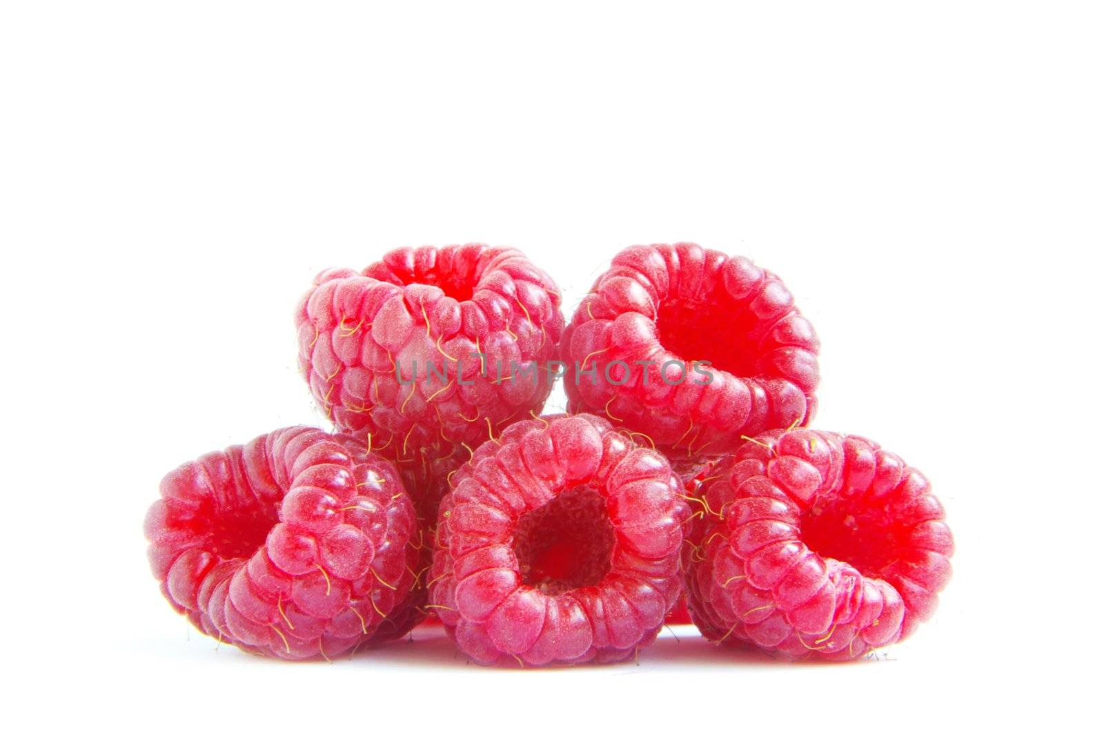 Ripe raspberry on a white background