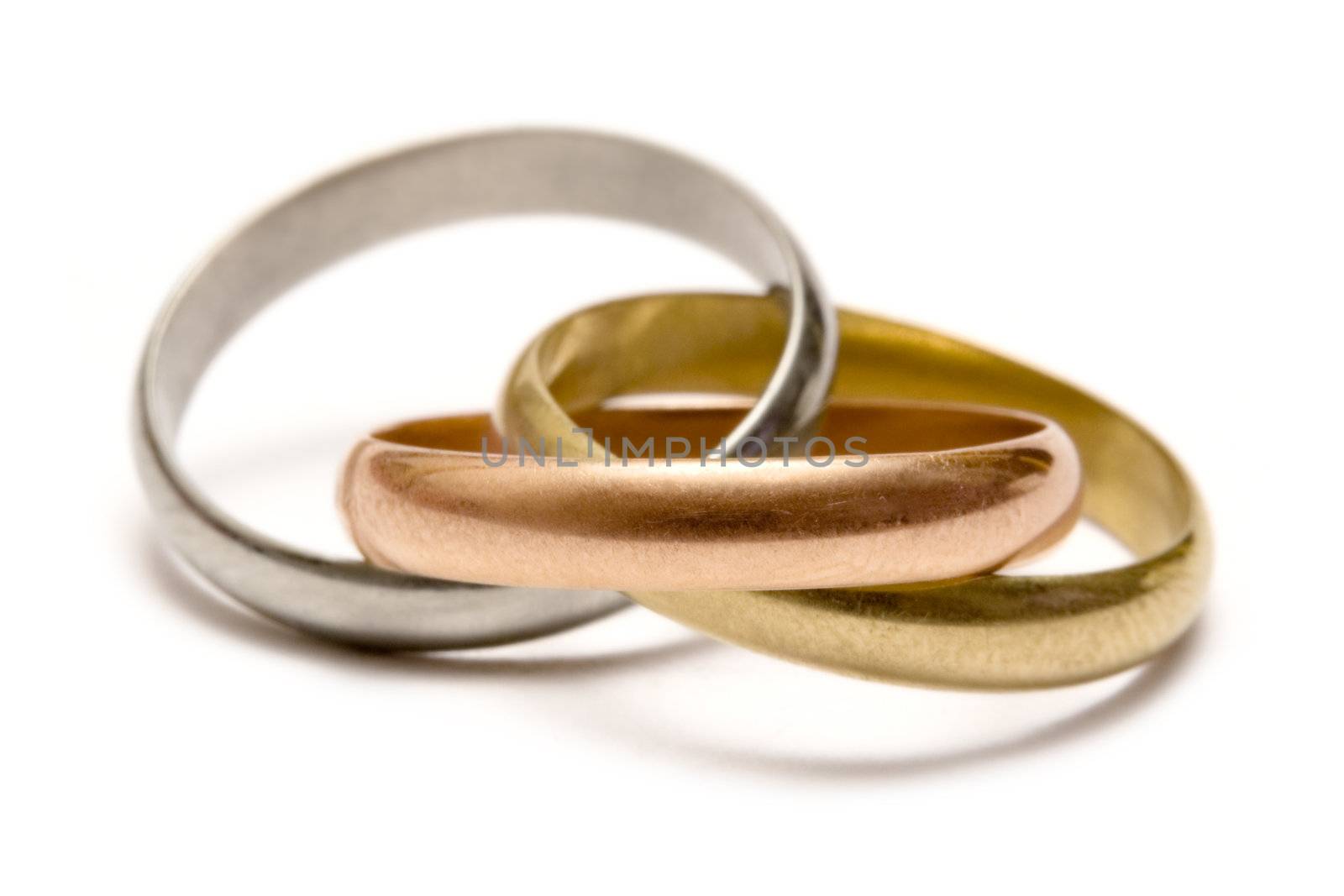 Gold, silver and bronze ring isolated on a white background.