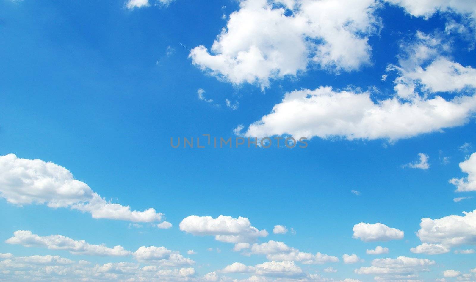 blue sky background with tiny clouds