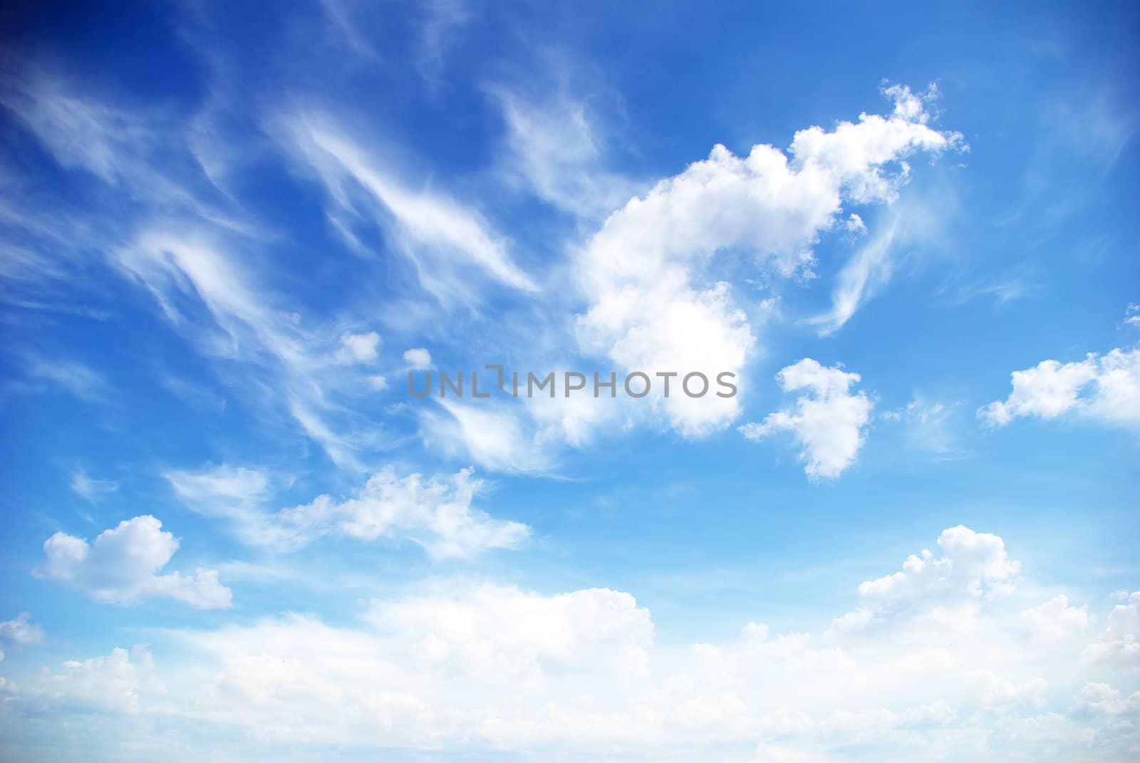 Blue sky background with a tiny clouds