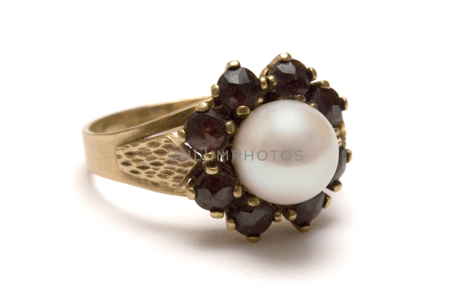 Golden pearl ring isolated on a white background.