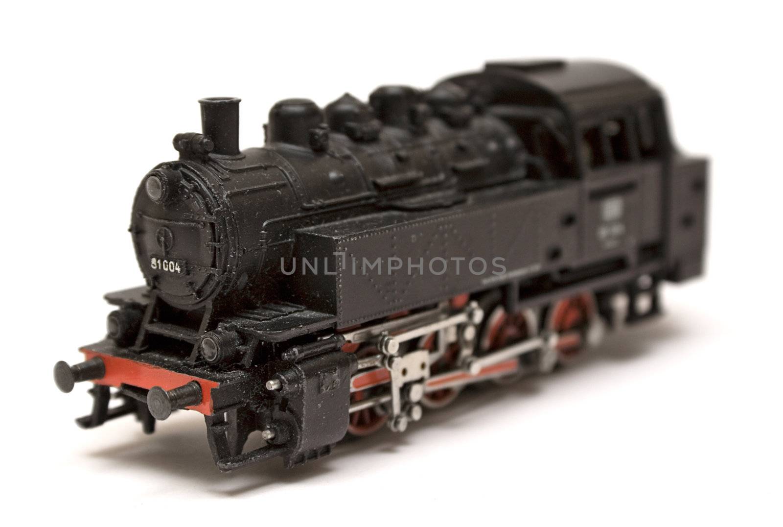 Black steam engine model isolated on a white background.