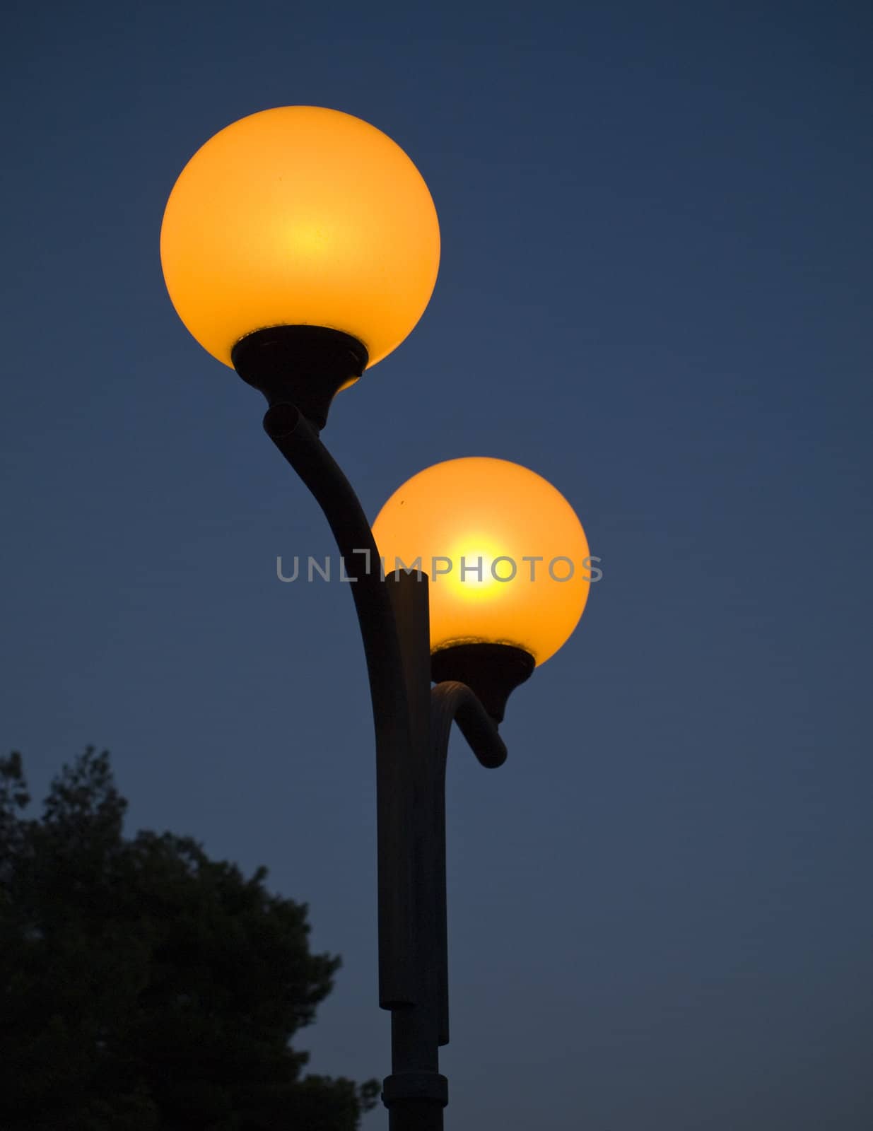 Lamp post against the deep dark sky