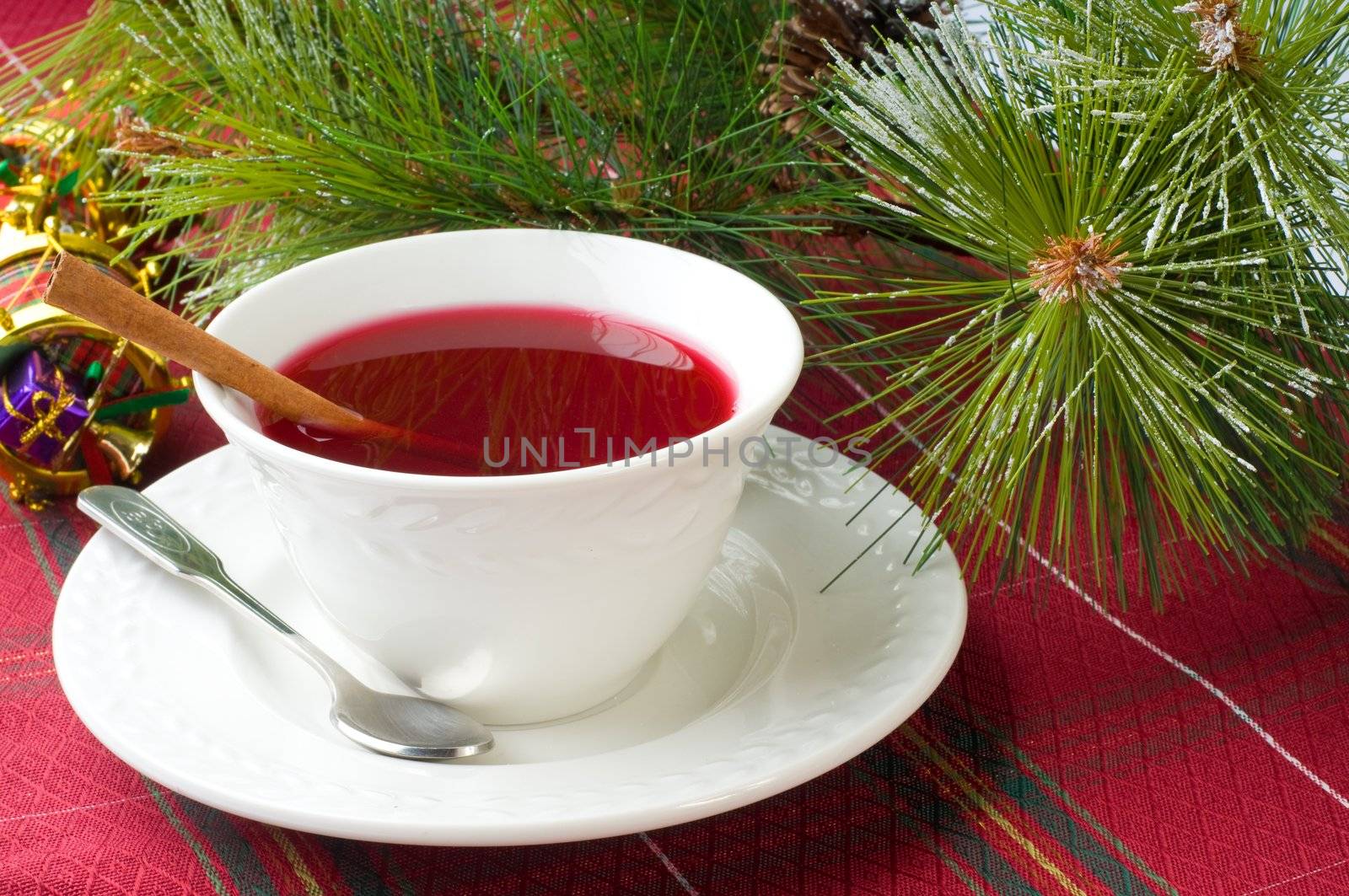 Cup of hot cranberry tea especially brewed for christmas,