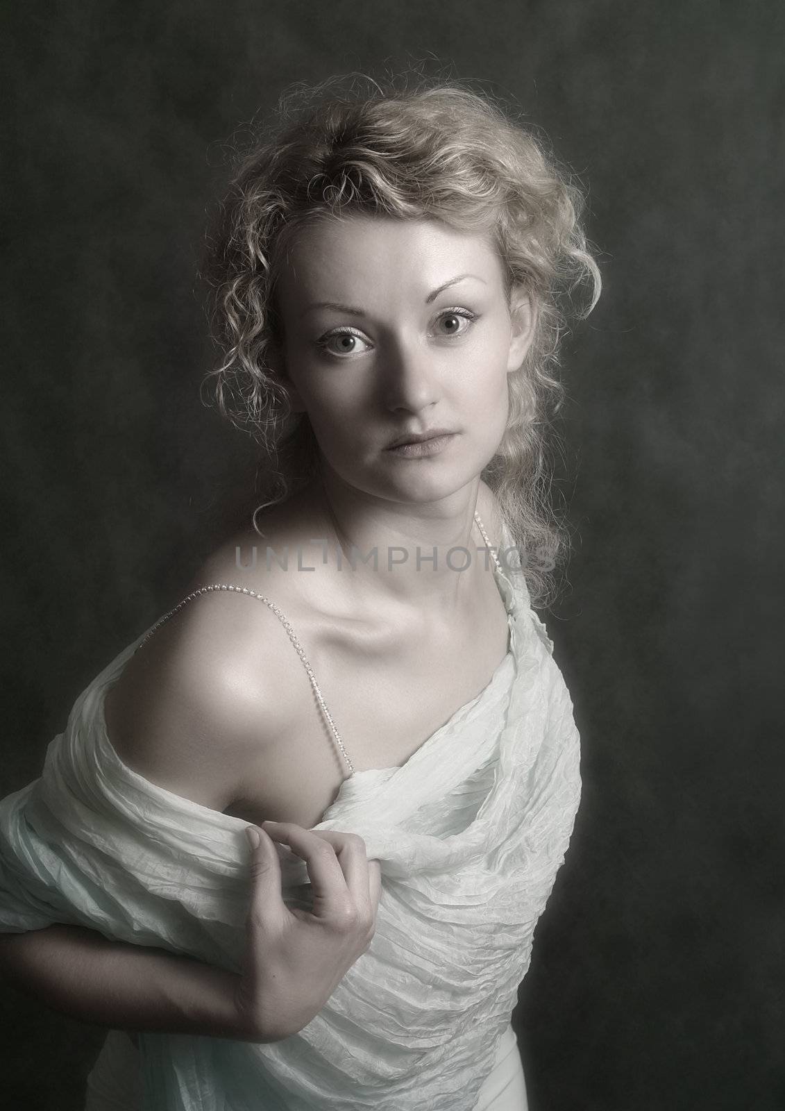 Portrait of the beautiful girl in studio